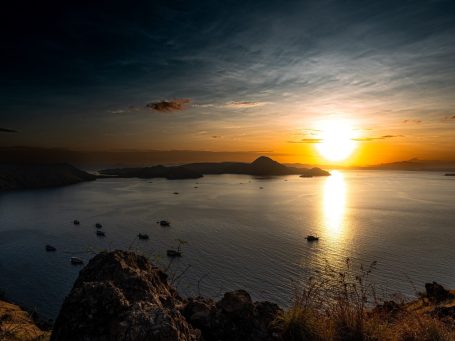 A tourist couple who are currently on the Komodo tour of Indocruis take a romantic couple selfie on Padar Island