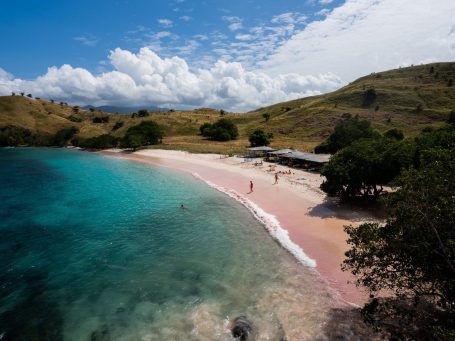 You can see the sand of Pink Beach in Indonesia from very close up. You can see the individual grains of pink sand