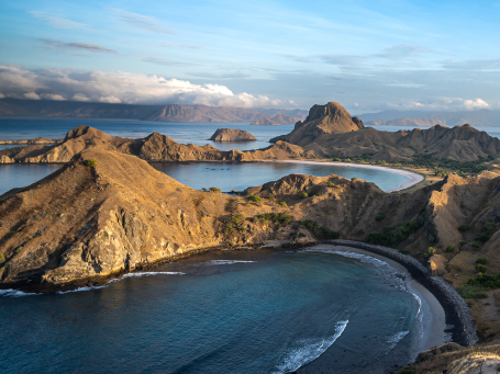 Tour boats moor in the bay of Padar Island to visit the island